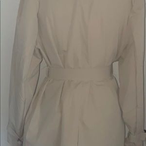 A tan mid length trench coat !